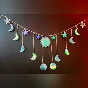 Moon phases, sun, and stars suncatcher